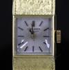 A lady's 18ct gold Longines manual wind wrist watch,                                                                                   