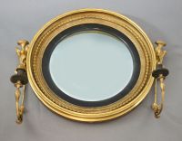 A William IV giltwood and gesso convex girandole, W.2ft 7in. H.2ft 2in.                                                                