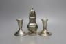 A modern pair of sterling mounted dwarf candlesticks, 92mm and a George V silver sugar caster, 16.5cm, 157 grams.                                                                                                           
