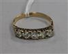 An 18ct gold and five stone diamond ring, size O.                                                                                      