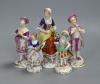 A German porcelain figure of a masked harlequin with stringed instrument and four other Continental porcelain figures, tallest 16cm                                                                                         