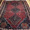 A Persian red ground rug 265cm x 205cm                                                                                                 