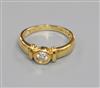 A modern 18ct gold and collet set solitaire diamond ring, size M.                                                                      