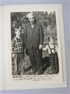 A black and white photograph of Albert Schweitzer standing with two children, apparently dated 27th October 1957 with card             