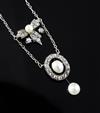 An Edwardian gold and silver, diamond and cultured? pearl drop necklace, pendant section 42mm.                                         