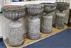 A set of four large cup shaped garden urns on fluted plinths (one a.f.) W.55cm approx.                                                 