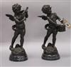 Two bronze sculptures of cherubs playing instruments, on marble bases tallest 32cm                                                     