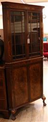 A banded walnut standing corner cupboard W.82cm                                                                                        