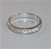 A modern 18ct white gold and seven stone diamond half hoop ring, size O.                                                               