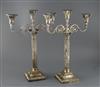 A pair of late Victorian silver corinthian column two branch, three light candelabra by Walker & Hall,(a.f.) height 45.5cm.            