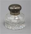 A Victorian silver mounted circular glass inkwell, 11.1cm.                                                                             