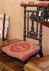 A Victorian ebonised prie dieu chair                                                                                                   