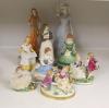 A German porcelain group of two children by a tree stump, on rocky base, two 'crinoline' figures and six other porcelain groups                                                                                             