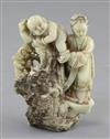 A Chinese export polychrome soapstone group of a mother and child, probably 18th century, height 11.5cm                                