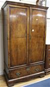 An early 18th century style walnut two door cupboard fitted one long drawer W.97cm                                                     