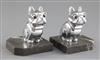 H. Moreau. A pair of Art Deco spelter bookends, modelled as a seated French Bulldog, height 4.25in.                                    