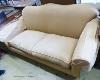 A large modern two seater settee upholstered in beige fabric W-200, D-98, H-94.                                                                                                                                             