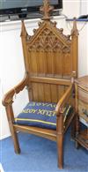 A Gothic style oak throne chair                                                                                                        