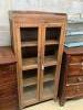 A continental fruitwood glazed cabinet, width 72cm, depth 34cm, height 165cm                                                                                                                                                