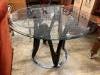 A contemporary circular glass top table, 120cm diameter, height 77cm                                                                                                                                                        