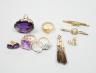 A large 9ct and oval cut amethyst dress ring, size L, three other rings including a 9ct gold buckle ring, an 18ct white gold and two stone crossover ring, two gem set bar brooches including 15ct and three assorted pairs 