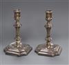 A pair of late Victorian silver tapersticks, Hawksworth, Eyre & Co, Sheffield, 1895, 10.6cm.                                           