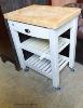 A T&G painted beech topped butchers block. W-70, D-50,H-89.                                                                                                                                                                 