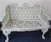 A white painted cast iron bench                                                                                                        