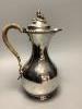 A Victorian silver baluster hot water jug, with acorn finial, by George Fox, London, 1876, height 25cm                                                                                                                      