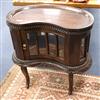 A reproduction kidney-shaped glazed tray-top cabinet W.76cm                                                                            