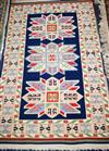 A Caucasian blue ground rug 156 x 92cm                                                                                                 