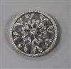 A white metal and diamond set open work circular brooch, 35mm.                                                                         