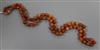 An early 20th century banded agate and other hardstone bead necklace, 80cm.                                                            