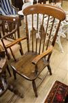 A Victorian elm and beech comb-back elbow chair                                                                                        