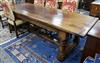 A 17th century style oak refectory table W.259cm                                                                                       