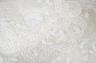 A cream tape vale on net bed cover, approximately 264 x 210cm                                                                                                                                                               