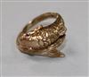 A 9ct gold "fish" ring with gem set eyes, size L.                                                                                      