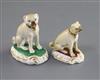 Two Rockingham porcelain figures of seated pugs, c.1830, H. 6.4cm and 5.5cm                                                            
