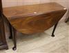 A George II figured mahogany dining table W.120cm.                                                                                     