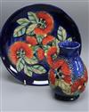 A Moorcroft Sally Tuffin Pohutukawa pattern vase, H 13cm and a trial plate in the same design, 1992                                    