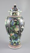 A Chinese famille noire enamelled biscuit baluster vase and cover, 19th century, 47cm high                                             