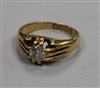 An Edwardian 18ct gold and claw set solitaire diamond ring, size K.                                                                    