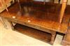 An oak coffee table W.122cm                                                                                                            