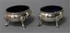 A matched pair of George III silver oval salts, on hoof feet.                                                                          