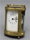 A 20th century oval brass carriage timepiece, the Roman dial marked Asprey London height 13cm - (In need of restoration)               