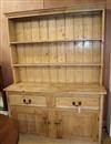 A Victorian pine dresser, with boarded plate rack W.151cm                                                                              