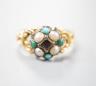 A late Victorian yellow metal, garnet, turquoise and split pearl cluster set dress ring, size M, gross weight 2.9 grams.                                                                                                    