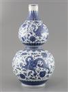 A Chinese blue and white 'dragon and phoenix' double gourd vase , Qianlong mark but late 19th/early 20th century, H. 35.cm             