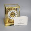 A Jaeger le Coultre Atmos mantel clock, with white enamelled Roman chapter ring, in gilt-brass panelled case, height 22.5cm                                                                                                 