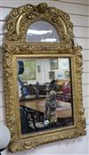 An 18th century giltwood and gesso wall mirror H.100cm                                                                                 